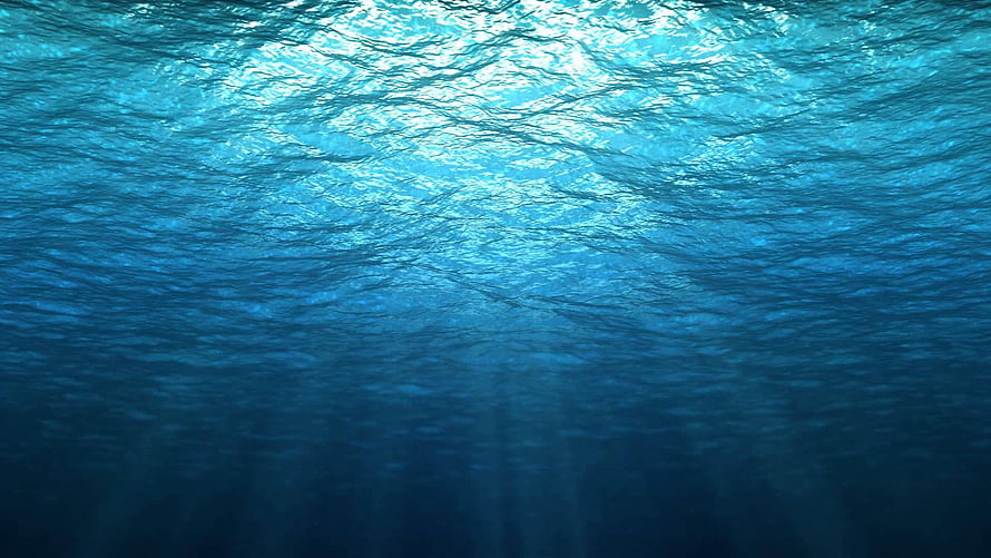 Deep Blue Ocean Underwater View With Sunlight Rays Penetrating The Surface HD wallpaper