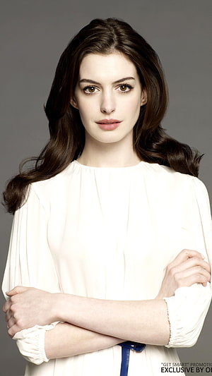 Anne Hathaway Studio Portrait in White Blouse with Arms Crossed HD phone wallpaper