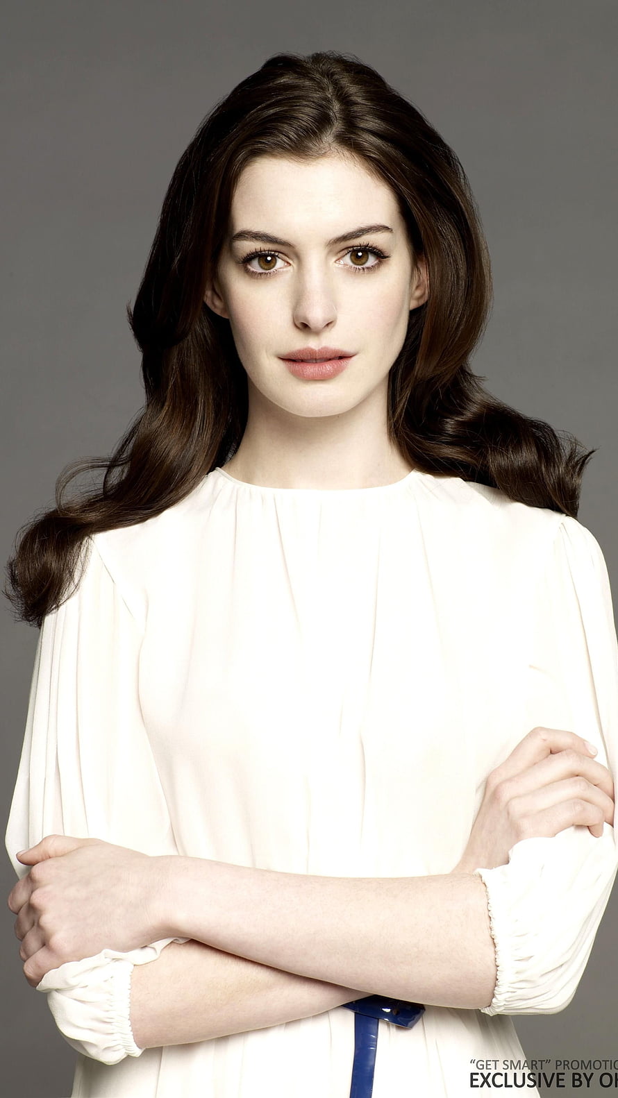 Anne Hathaway Studio Portrait in White Blouse with Arms Crossed HD phone wallpaper