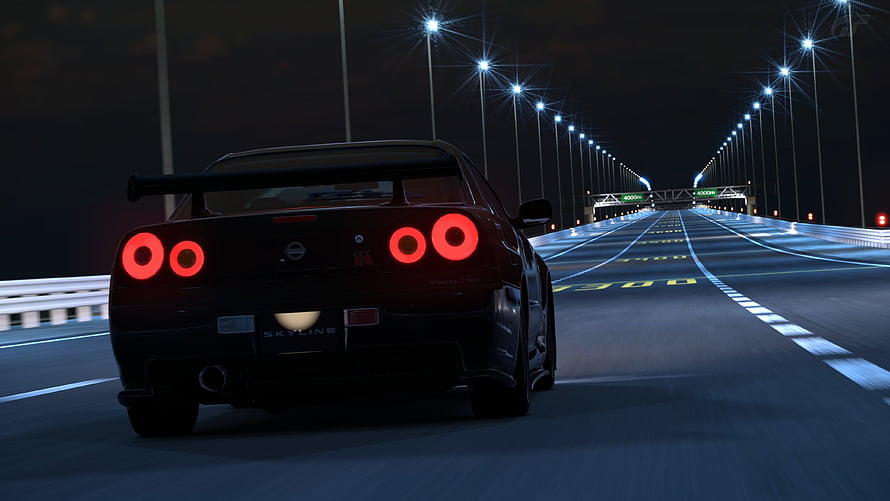 Nissan Skyline GT-R R34 Rear View on Night Highway with Glowing Red Taillights HD wallpaper