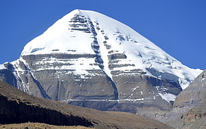 Mount Kailash Snow-Capped Peak in the Himalayas Under a Clear Blue Sky HD wallpaper