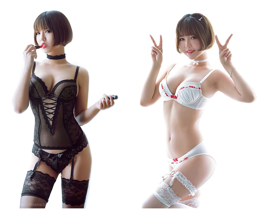 Asian model posing in black lace bodysuit and white lingerie set against white background HD wallpaper