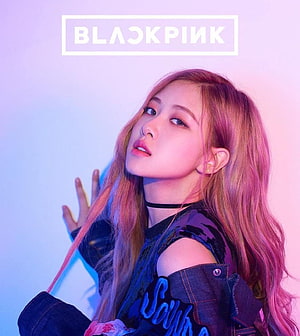 Rosé from Blackpink in a stylish denim jacket with pink and blue lighting HD phone wallpaper