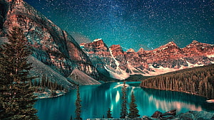 Maligne Lake and Mount Robson under a starry night sky in the Canadian Rockies HD wallpaper