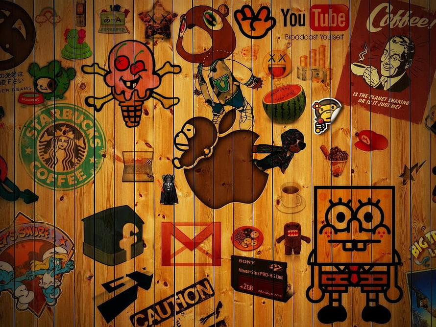 Wooden Wall Covered In Pop Culture Stickers Including SpongeBob, Apple, Starbucks, And YouTube Logos HD wallpaper