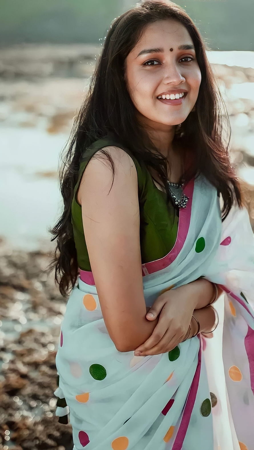 Anikha Surendran in a Polka Dot Saree by the Water HD phone wallpaper