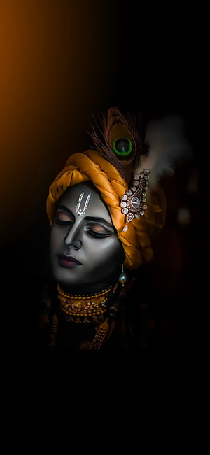 Serene Portrait of Lord Krishna with Peacock Feather and Yellow Turban HD phone wallpaper