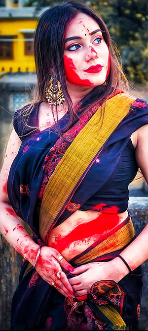Young woman in traditional saree with vibrant red Holi colors on face and hands, Beautiful girl, holi HD phone wallpaper