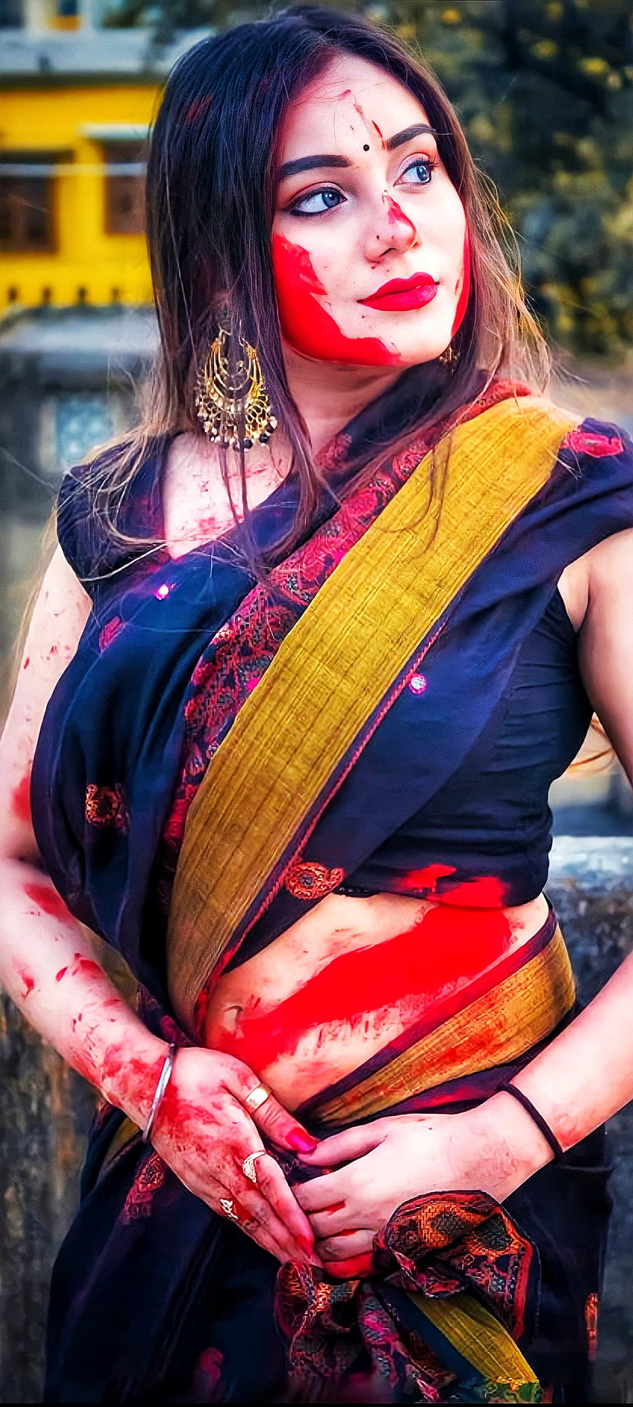 Young woman in traditional saree with vibrant red Holi colors on face and hands, Beautiful girl, holi HD phone wallpaper