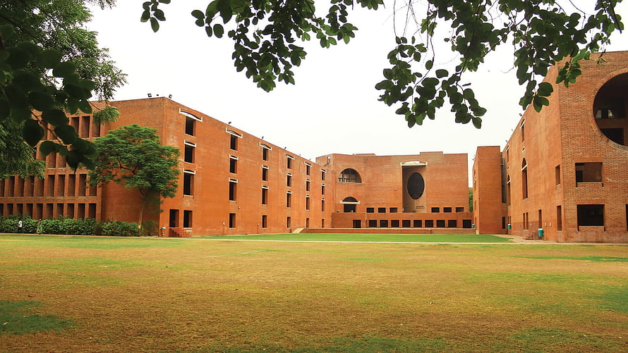 Modern Red Brick University Campus Architecture with Green Lawn and Trees HD wallpaper