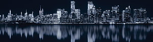 New York City Skyline at Night with Water Reflections in Cool Blue Tones HD wallpaper