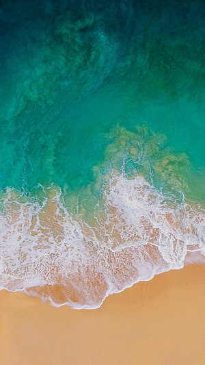 Aerial View of Turquoise Ocean Waves Crashing on Golden Sandy Beach HD phone wallpaper