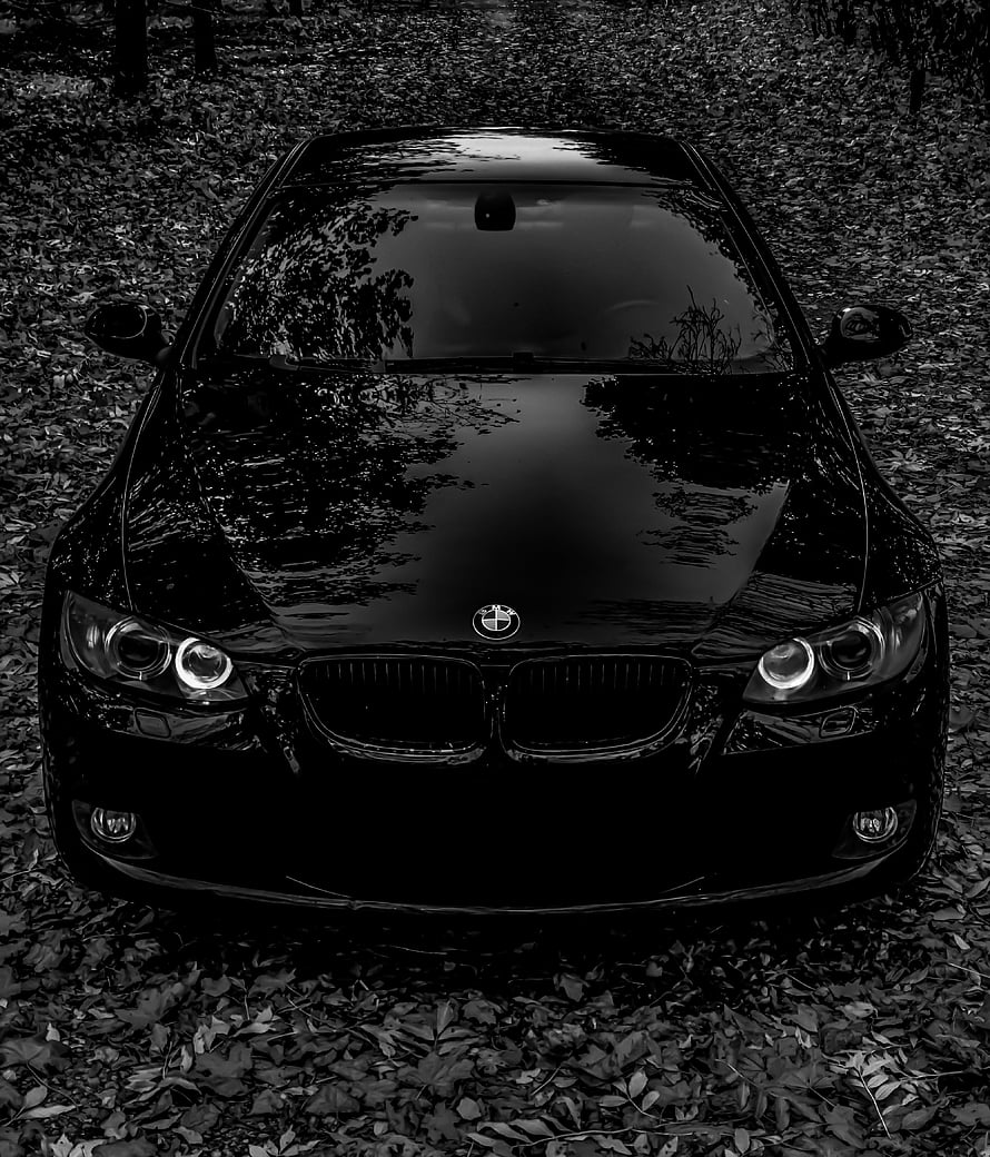 Black BMW E92 Front View in Monochrome Forest Setting HD phone wallpaper