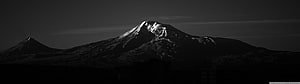 Dramatic Black and White Snow-Capped Mountain Peak at Dusk HD wallpaper