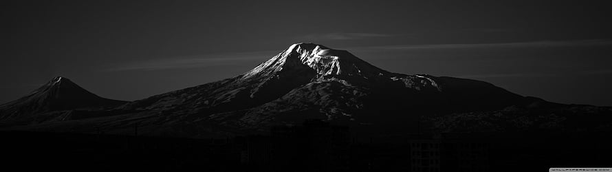 Dramatic Black and White Snow-Capped Mountain Peak at Dusk HD wallpaper