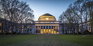Massachusetts Institute of Technology Great Dome at Dusk with Illuminated Columns and Bare Trees HD wallpaper