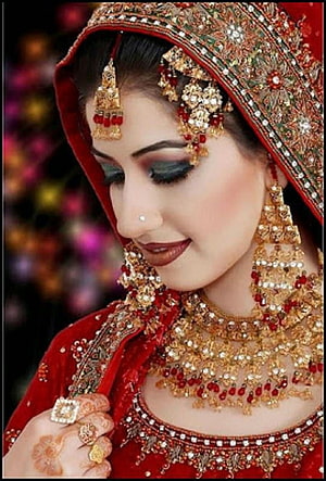 Elegant Indian Bride in Red Lehenga with Gold Jewelry and Henna HD phone wallpaper