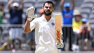 Virat Kohli Celebrating a Milestone in White Cricket Uniform HD wallpaper