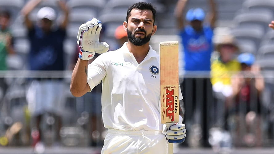 Virat Kohli Celebrating a Milestone in White Cricket Uniform HD wallpaper