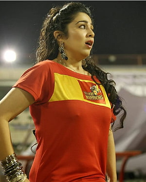 Charmi Kaur in Telugu Warriors Jersey at Night Stadium HD phone wallpaper