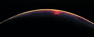 Dramatic Planet Horizon at Sunset with Glowing Atmosphere and Starry Space Background HD wallpaper