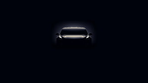 Black Tesla Front View Silhouette in Dramatic Dark Lighting HD wallpaper