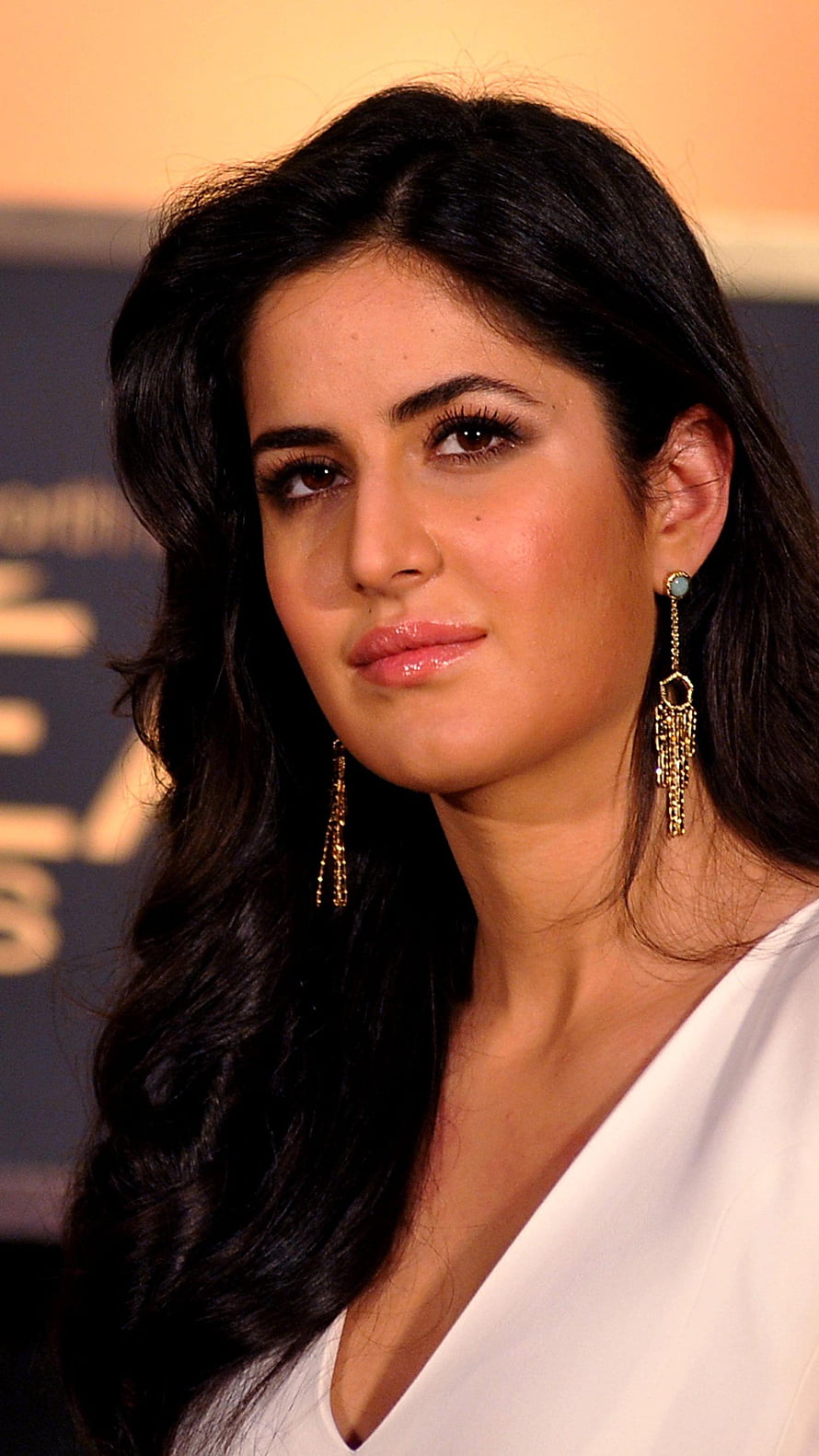 Katrina Kaif in White V-Neck Top with Gold Tassel Earrings at Event HD phone wallpaper