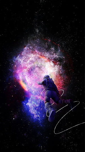 Astronaut Floating In Space Reaching Towards A Vibrant Purple And Pink Nebula Galaxy HD phone wallpaper