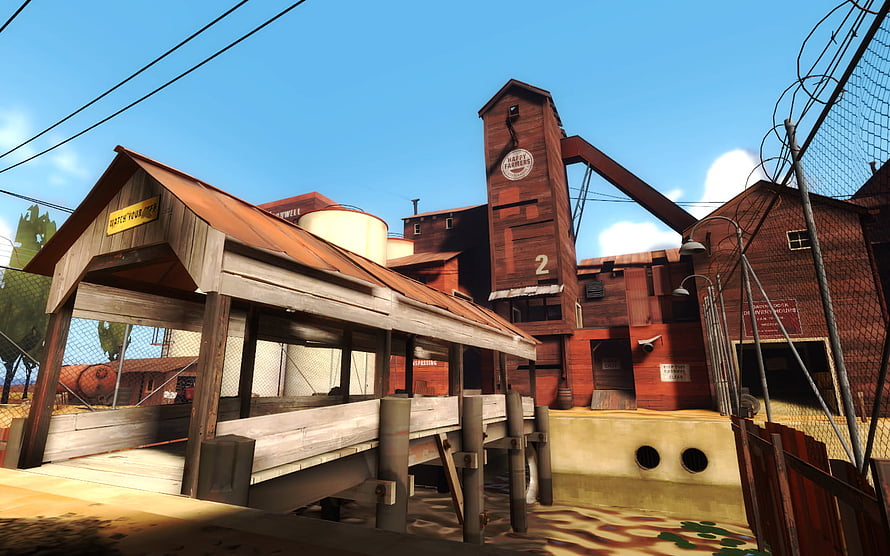 Team Fortress 2 2Fort Map Screenshot with Rusty Industrial Structures and Clear Blue Sky HD wallpaper
