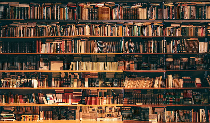 Vintage Antique Bookshelf Filled With Old Leather Bound Books In A Classic Library Setting HD wallpaper