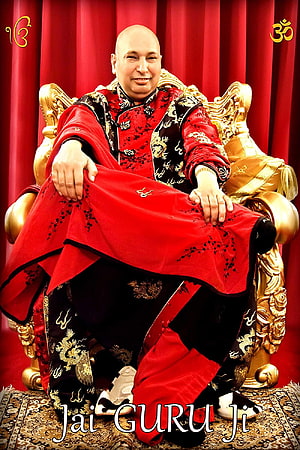 Bald spiritual leader in red and black traditional attire sitting on ornate golden throne HD phone wallpaper