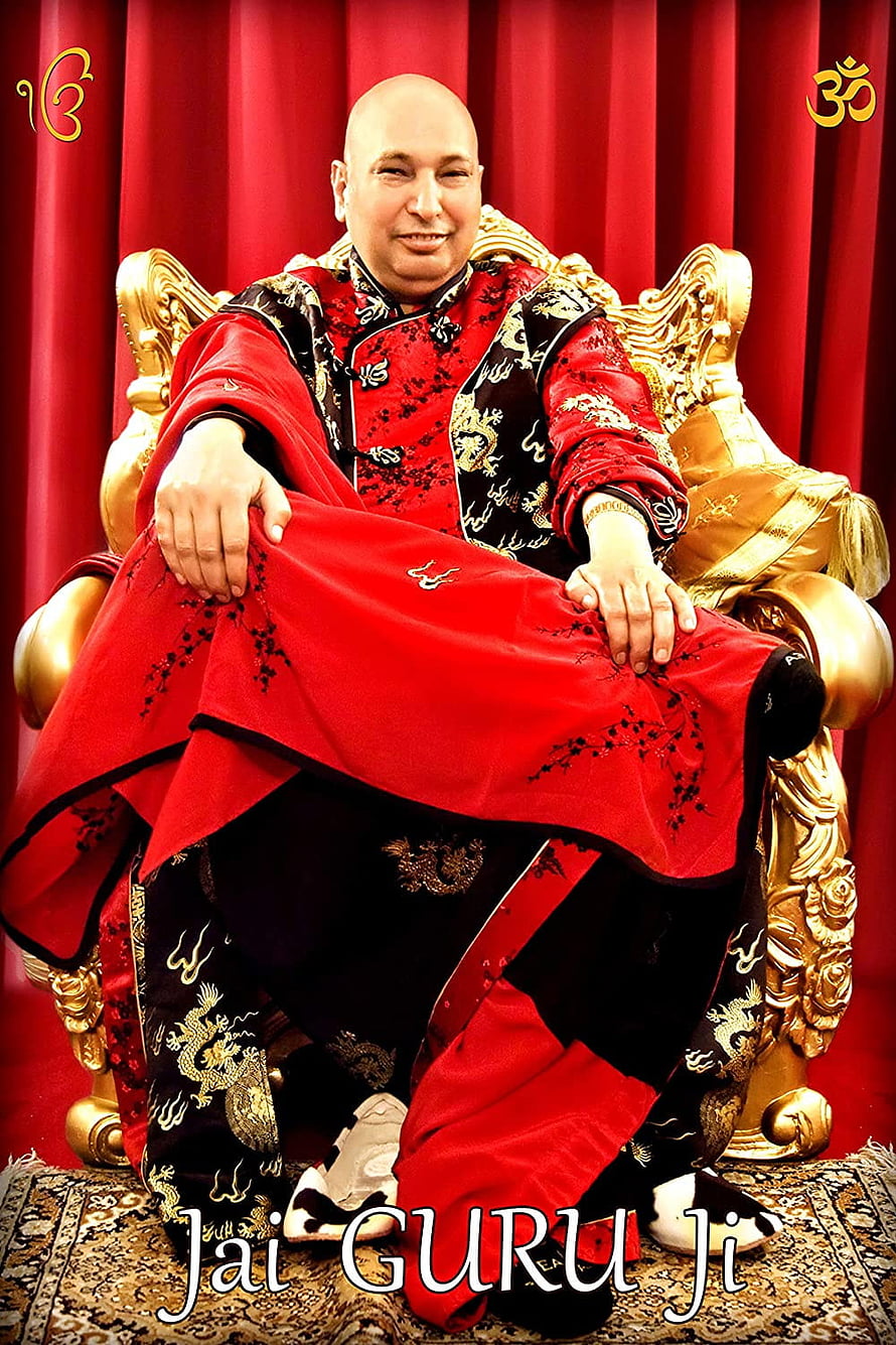 Bald spiritual leader in red and black traditional attire sitting on ornate golden throne HD phone wallpaper