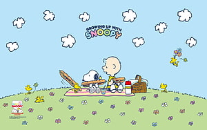 Snoopy and Charlie Brown Enjoying a Picnic with Woodstock in a Flower Field HD wallpaper