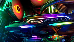 MSI GeForce RTX Graphics Card with RGB Lighting Inside a Custom PC Build HD wallpaper