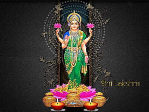 Goddess Lakshmi in Green Saree Holding Pink Lotuses with Gold Coins and Diyas HD wallpaper