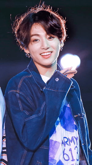 Stunning Portrait of K-pop Idol Stanning in Denim Jacket with Bright Smile HD phone wallpaper