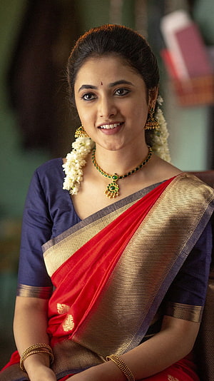 Radhika Pandit in a red and gold silk saree with traditional jewelry HD phone wallpaper