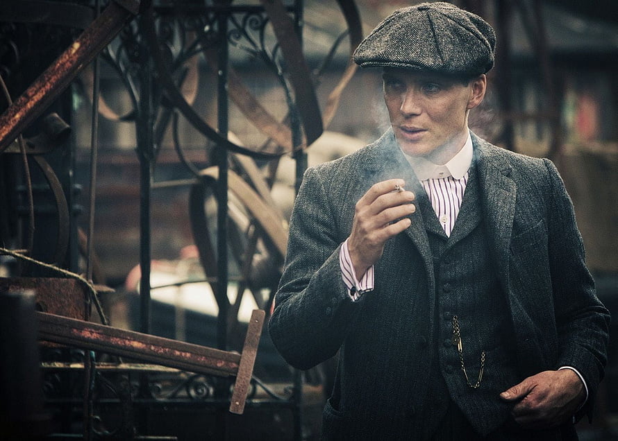 Peaky Blinders Tommy Shelby in Tweed Suit and Flat Cap Smoking Cigarette HD wallpaper