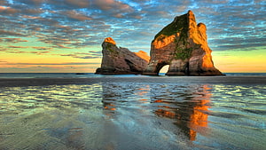 Wharariki Beach New Zealand Sunset Rock Formations HD wallpaper