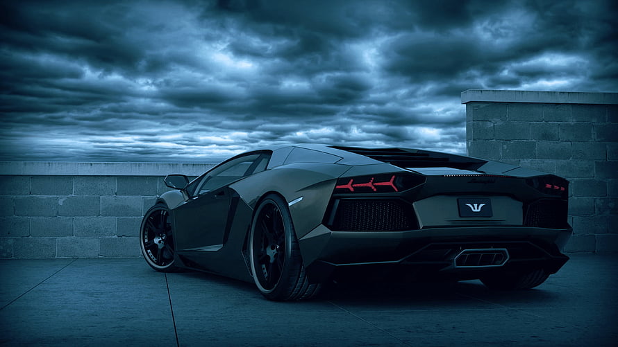 Matte Black Lamborghini Aventador Rear View Under Stormy Blue Sky HD wallpaper