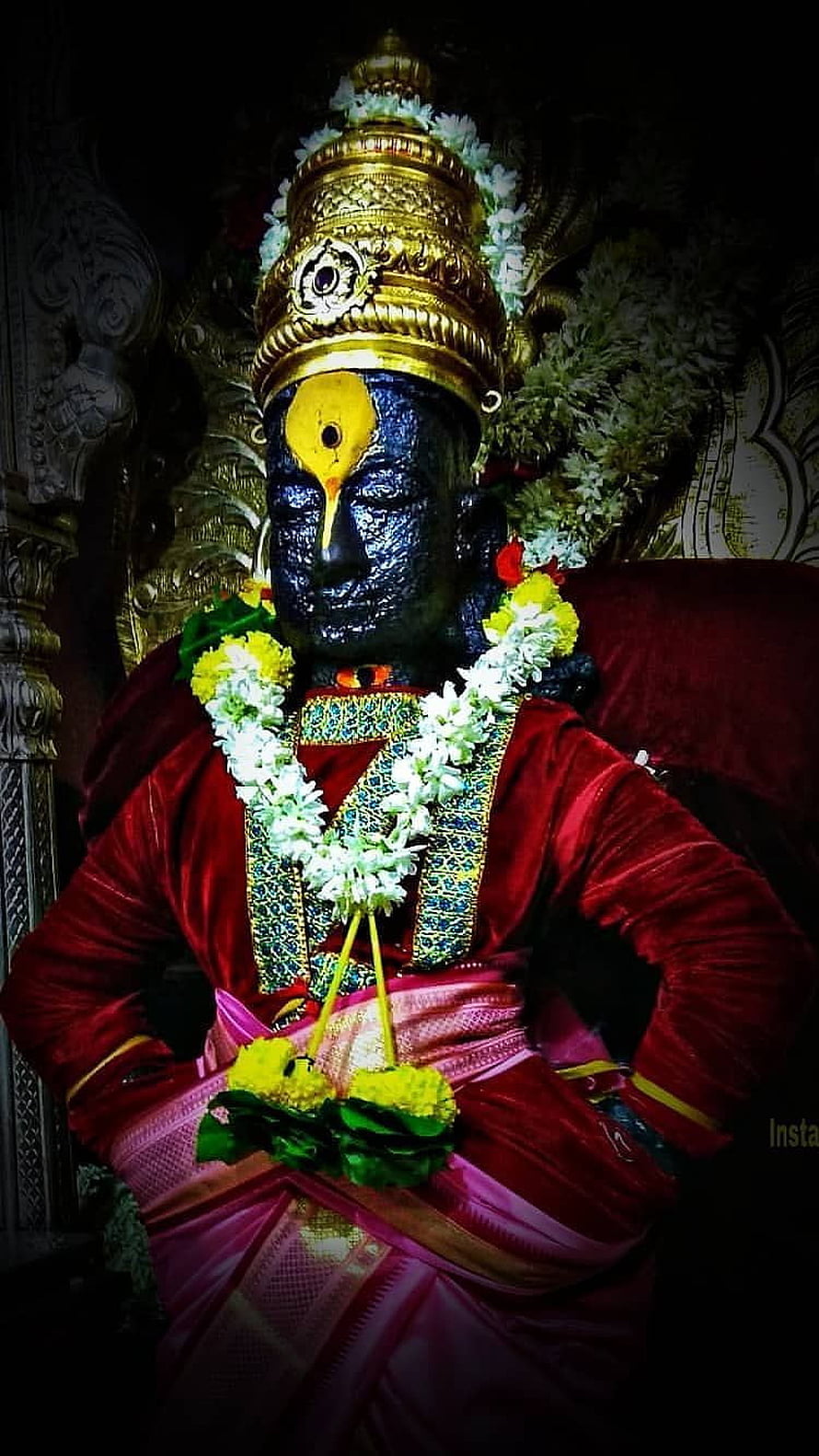 Statue of Lord Ayyappa adorned with golden crown and flower garlands HD phone wallpaper