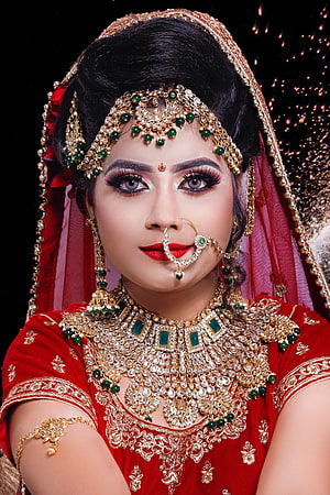 Indian Bride in Red Lehenga with Gold Jewelry and Traditional Makeup HD phone wallpaper