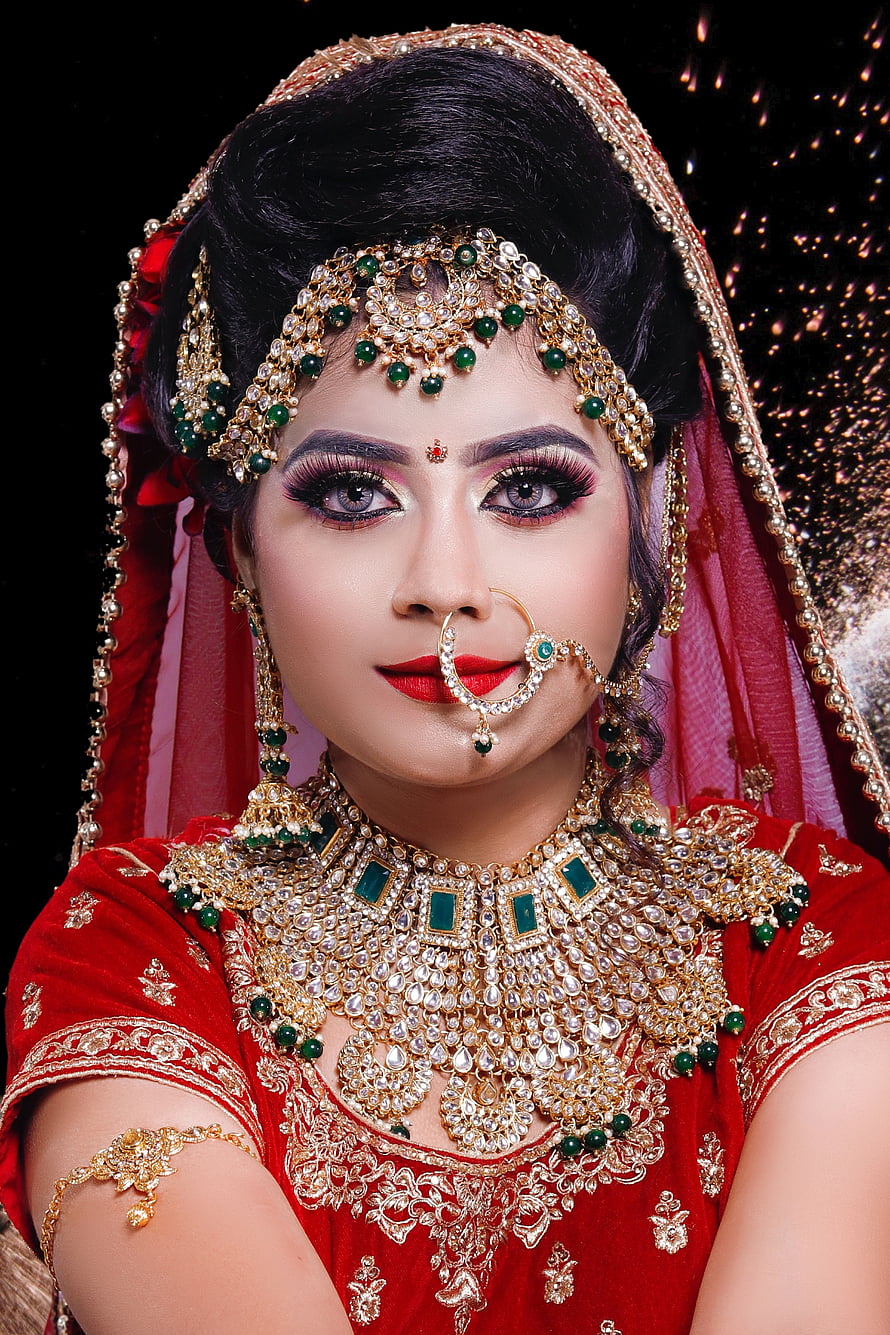 Indian Bride in Red Lehenga with Gold Jewelry and Traditional Makeup HD phone wallpaper