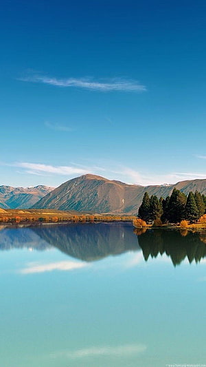 Serene Mountain Lake Reflection Under a Clear Blue Sky with Autumn Foliage HD phone wallpaper