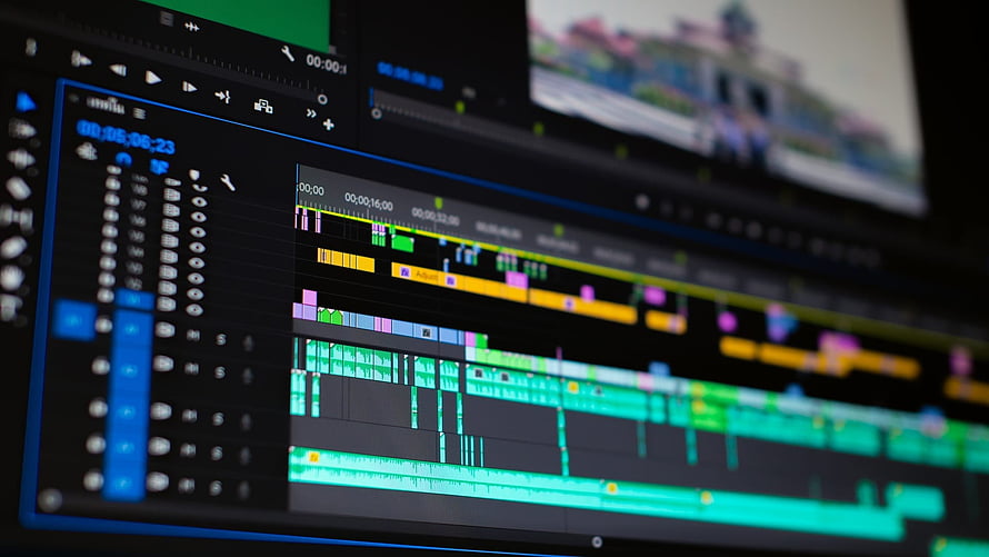Professional Video Editing Timeline on Dual Monitor Setup HD wallpaper