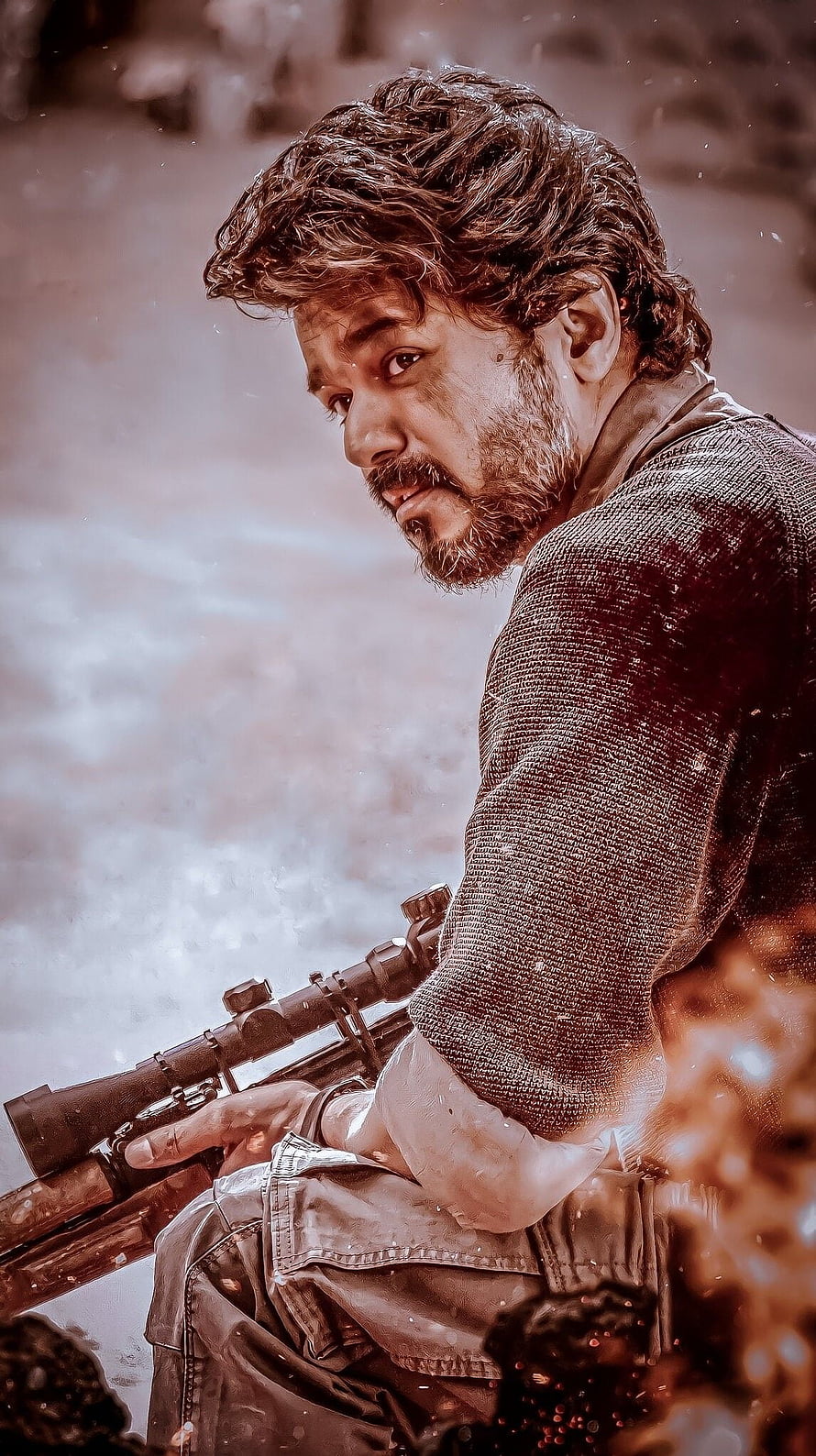 Vijay as Beast in a gritty action scene holding a sniper rifle HD phone wallpaper