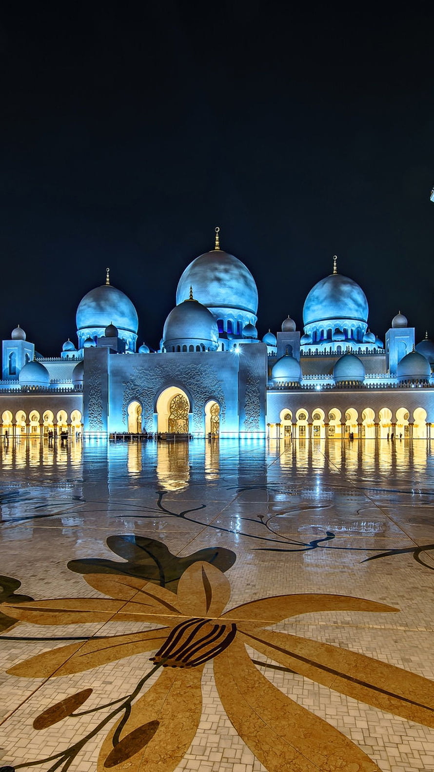 Sheikh Zayed Grand Mosque illuminated at night with blue domes and golden floral mosaic courtyard HD phone wallpaper