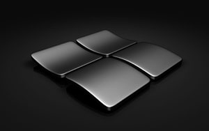 Sleek Metallic Microsoft Windows Logo on Dark Background HD wallpaper