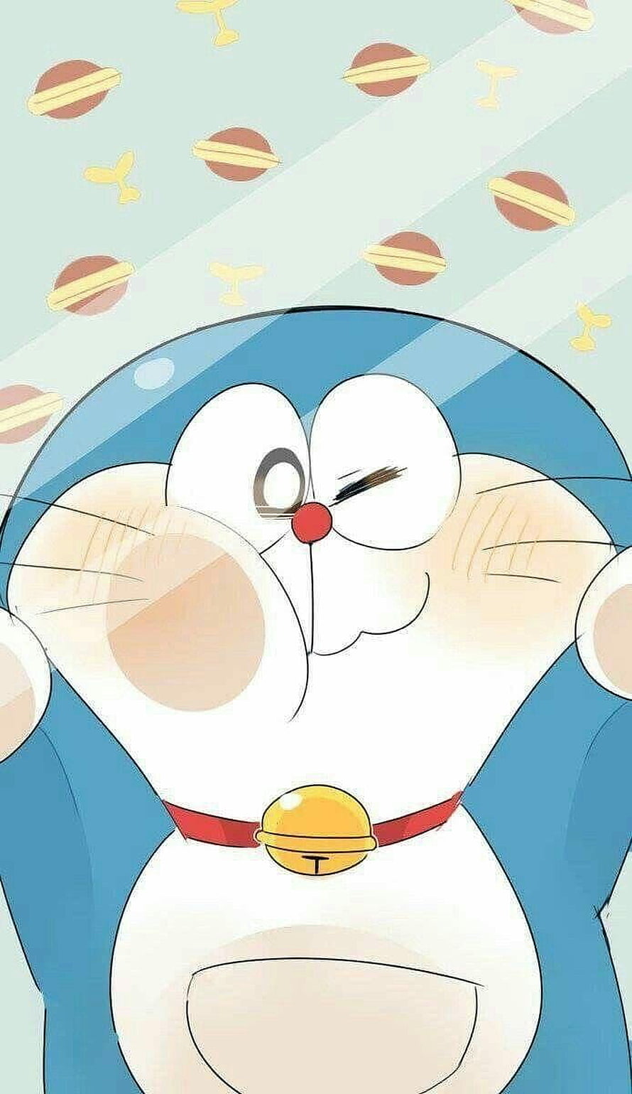 Doraemon Winking with Rosy Cheeks and Bell Collar on Patterned Background HD phone wallpaper