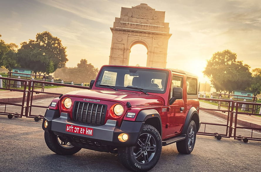 Red Mahindra Thar SUV Parked in Front of India Gate at Sunset HD wallpaper